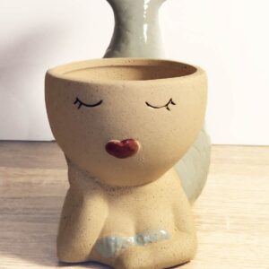 This beautiful Mermaid planter is unique with very limited stock available in soft earth tones of pale green & earthy light brown